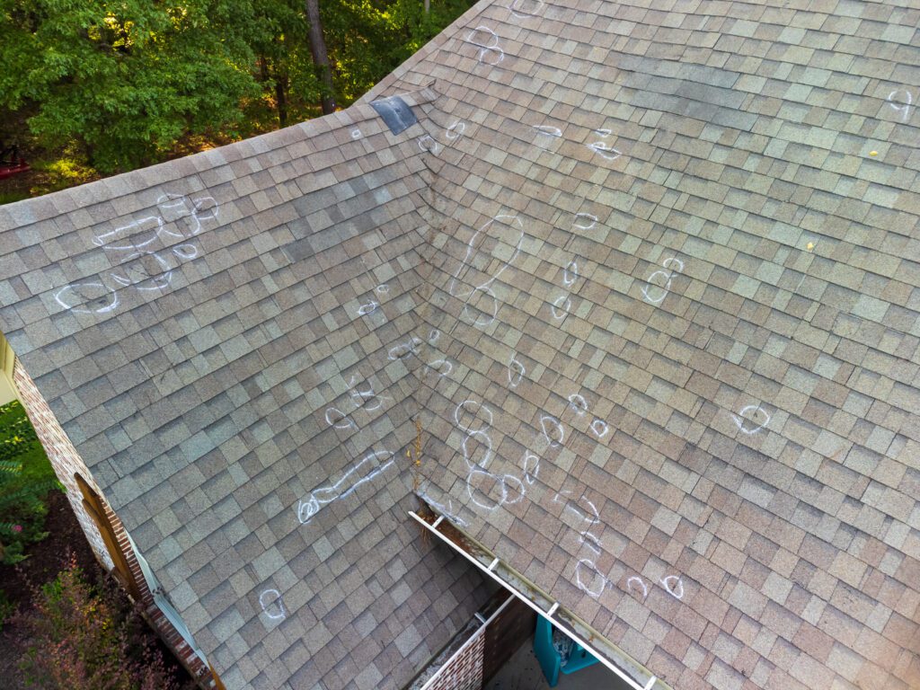 A Roof With Damage In the Glacier Bay Area With Lucero’s Roofing
