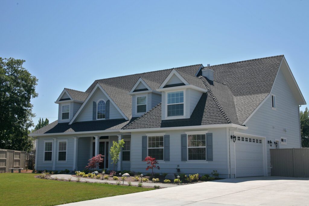 A beige home with a newly installed roof